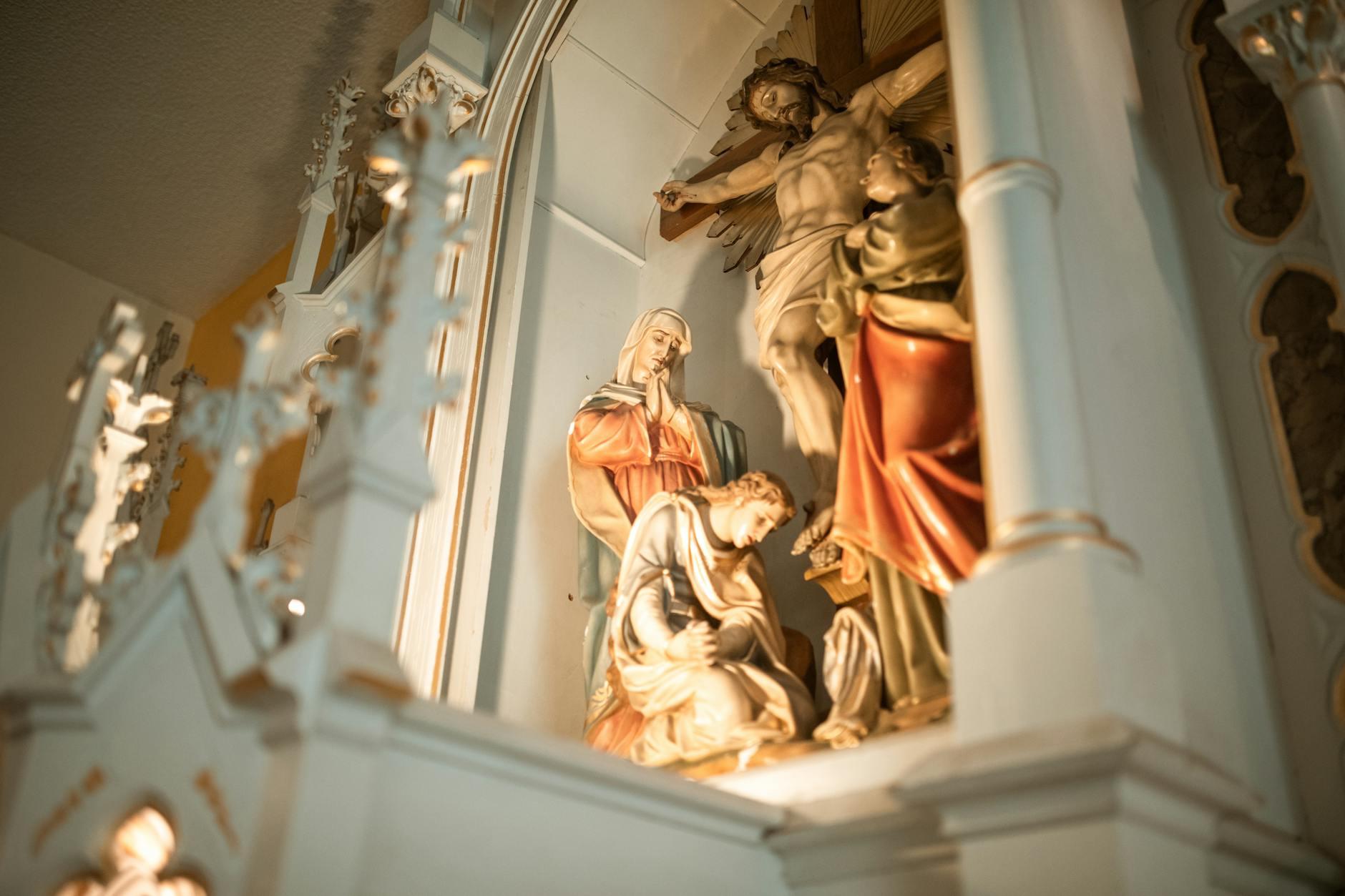 gold and white concrete statue